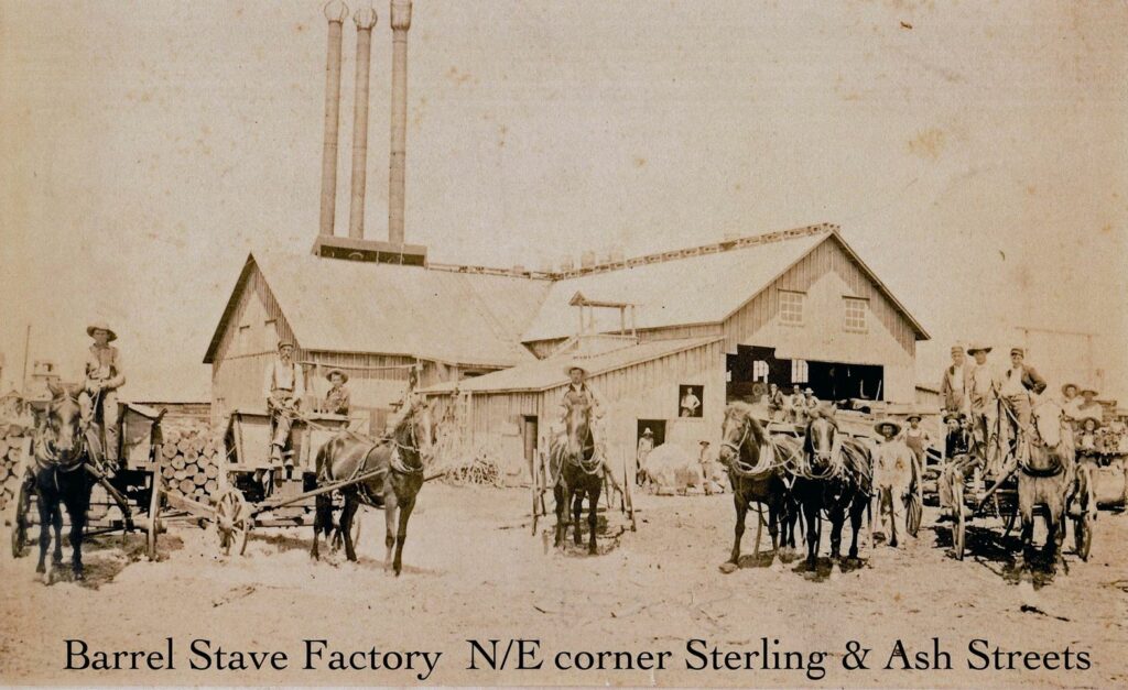 Historic barrel stave factory with horse-drawn carts.