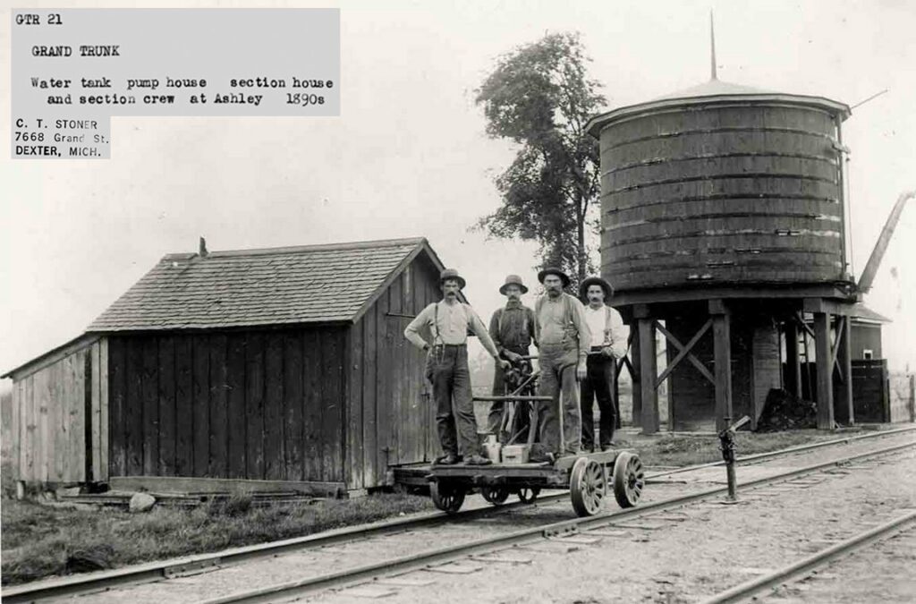 1890s railway workers by water tank and pump house